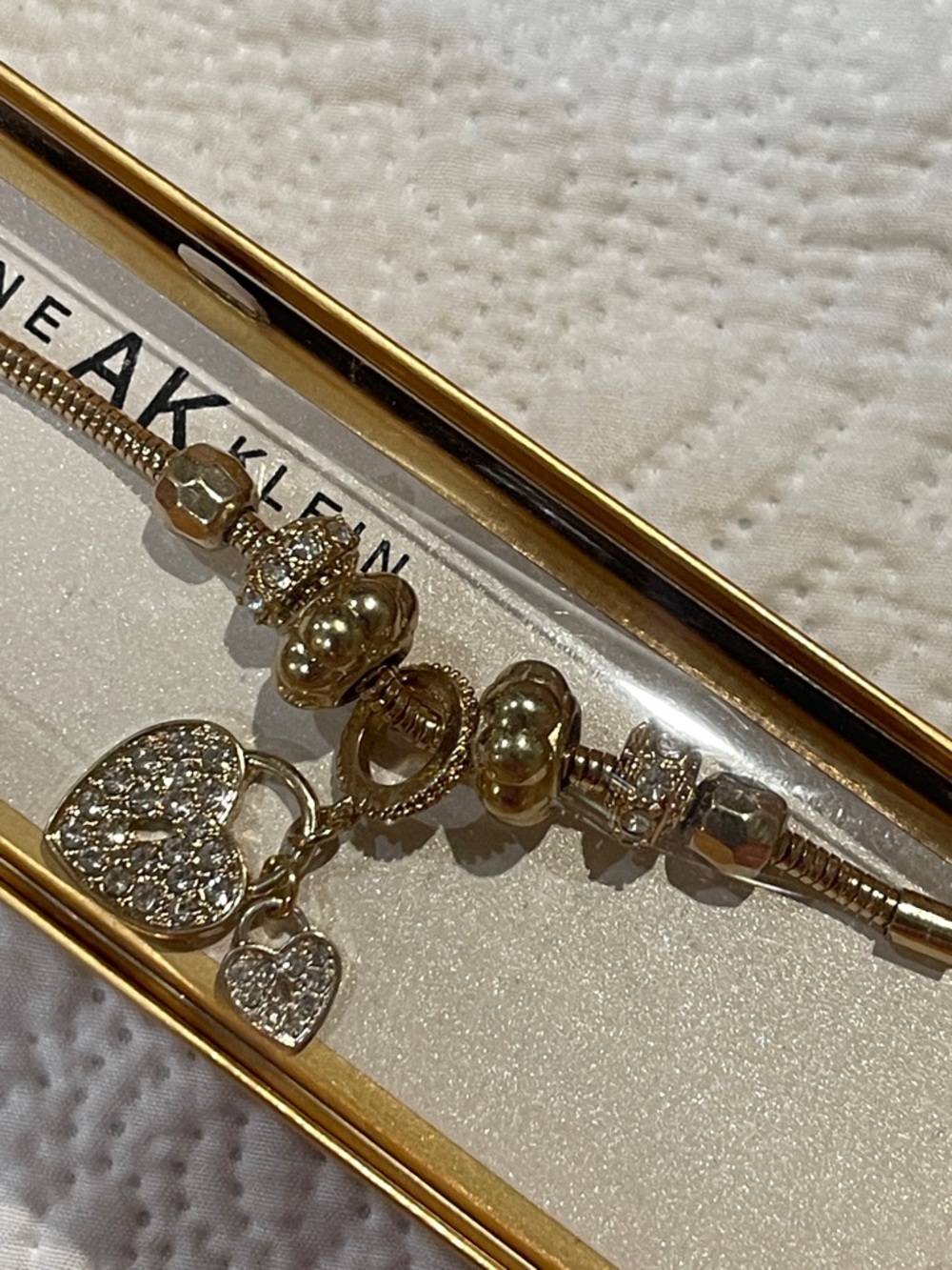 Anne Klein Gold Tone Charm Bracelet with Pavé Heart Dangles